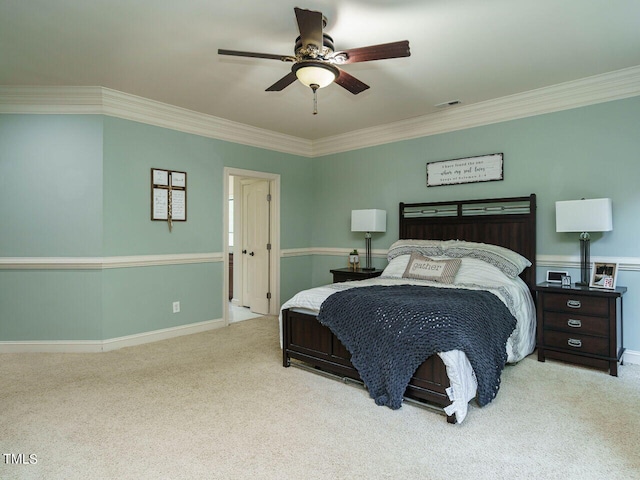 carpeted bedroom featuring ceiling fan and ornamental molding