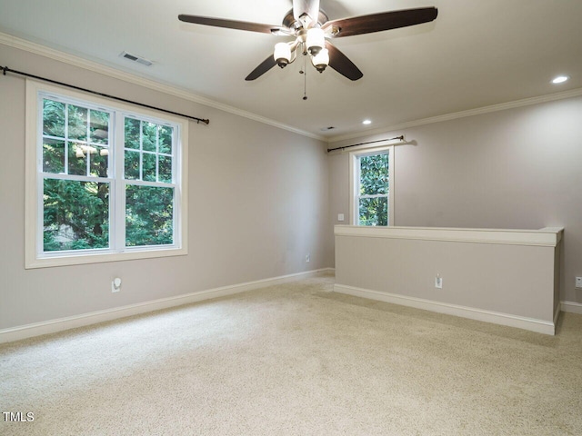 unfurnished room featuring crown molding, a healthy amount of sunlight, and ceiling fan