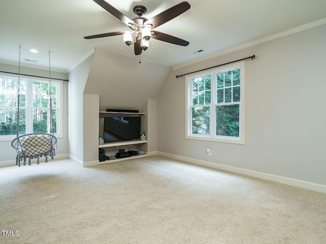 unfurnished living room with a wealth of natural light, vaulted ceiling, carpet floors, and ceiling fan