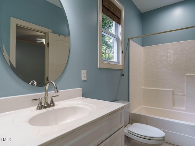 full bathroom featuring toilet, tub / shower combination, and vanity