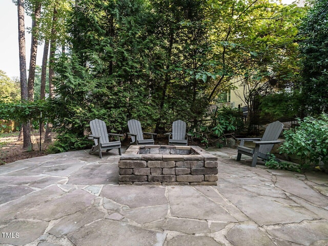 view of patio / terrace with a fire pit