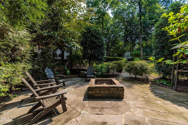 view of patio / terrace featuring a fire pit