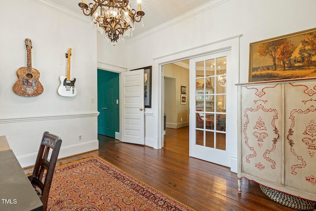 interior space featuring ornamental molding, a chandelier, and dark wood-type flooring