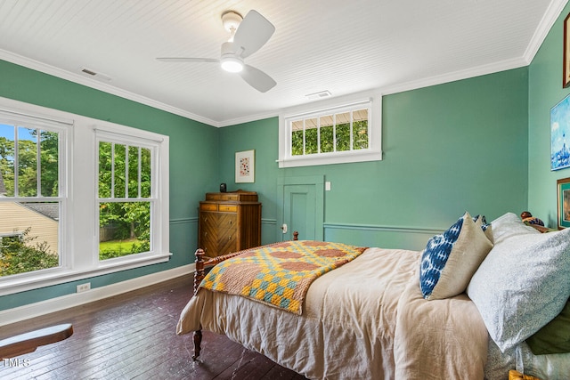 bedroom featuring crown molding, dark hardwood / wood-style flooring, and ceiling fan