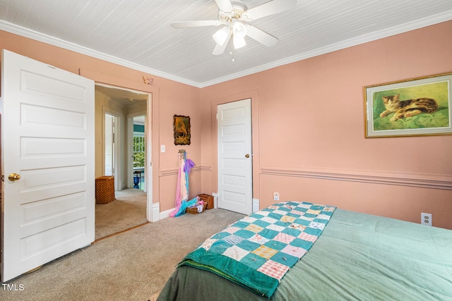 bedroom with ceiling fan, carpet floors, and ornamental molding