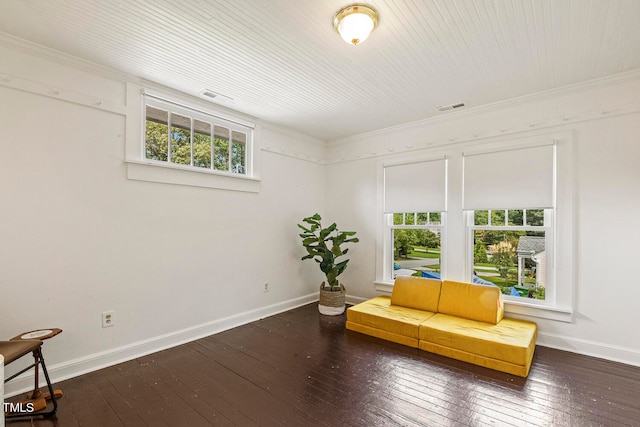 living area featuring crown molding, dark hardwood / wood-style flooring, and a healthy amount of sunlight