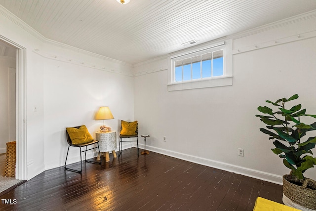 living area featuring dark hardwood / wood-style floors and ornamental molding