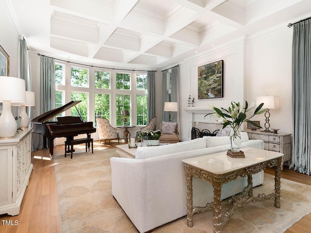 living room featuring coffered ceiling, light wood-style floors, and beamed ceiling