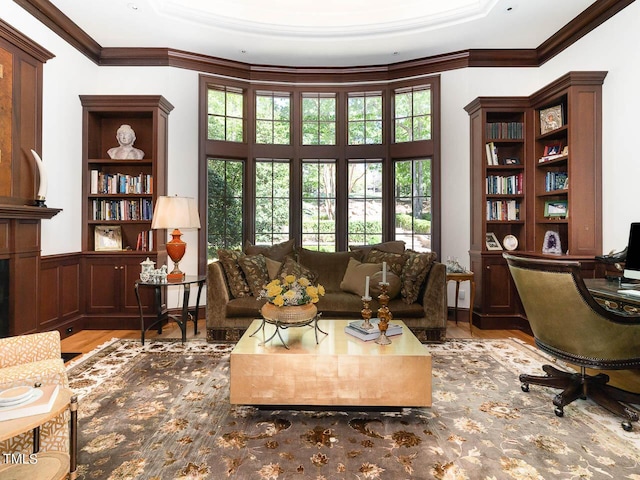 living room featuring crown molding and wood finished floors
