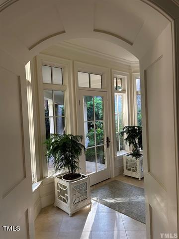 doorway to outside featuring light tile patterned floors