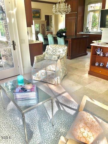 living room featuring an inviting chandelier and a healthy amount of sunlight