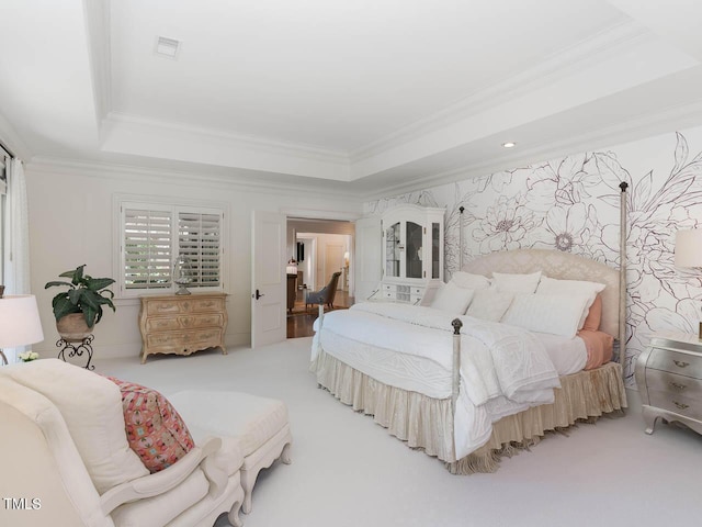 bedroom featuring a raised ceiling, carpet floors, ornamental molding, and wallpapered walls