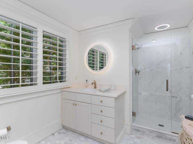 full bathroom featuring vanity, a marble finish shower, and crown molding