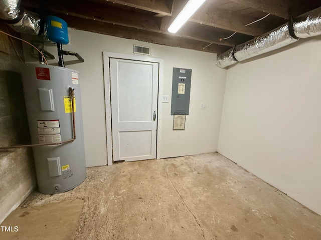 basement featuring water heater and electric panel