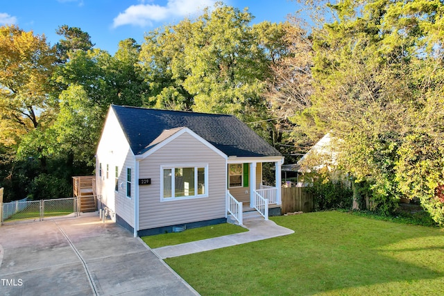 view of front facade with a front lawn and a patio area