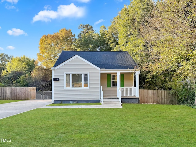 view of front of home with a porch and a front lawn