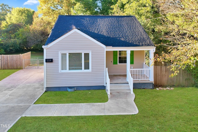 bungalow featuring a porch and a front yard