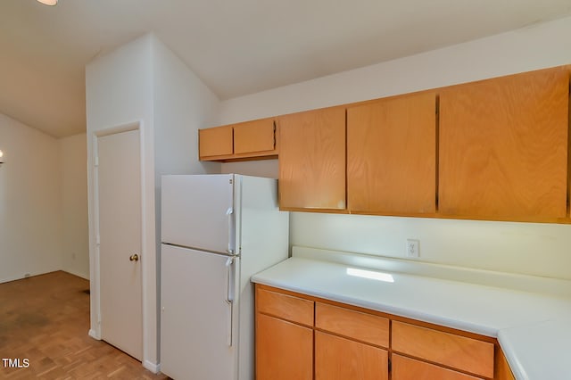 kitchen featuring white fridge and light parquet floors