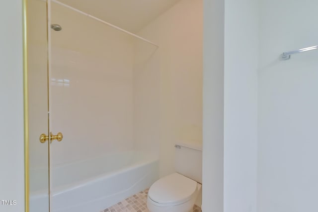 bathroom with toilet, shower / bath combination, and tile patterned floors