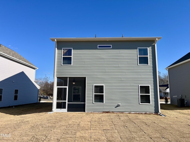 back of house featuring central AC