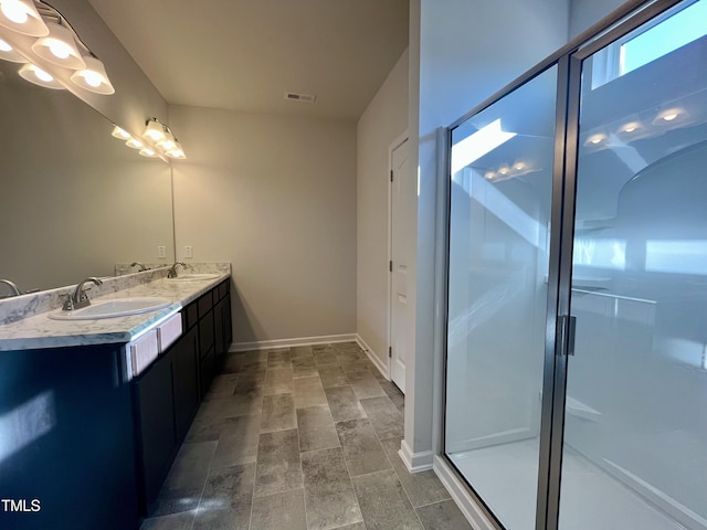 bathroom with vanity and walk in shower