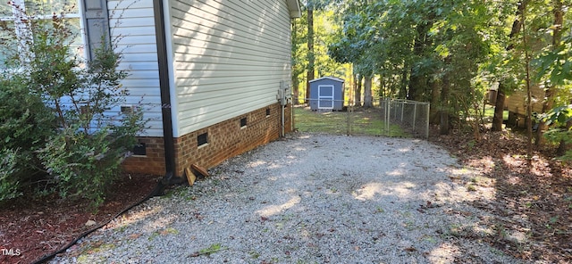 view of property exterior featuring a storage unit