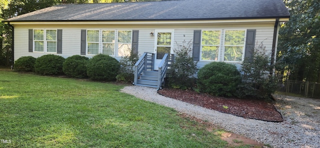 single story home featuring a front yard