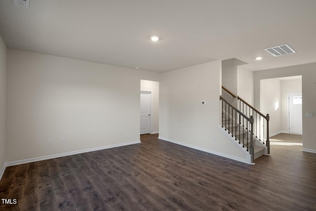 unfurnished room featuring dark hardwood / wood-style floors