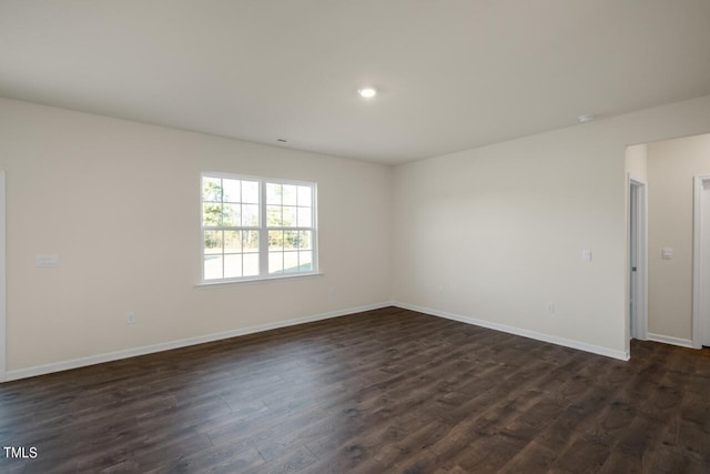 empty room featuring dark hardwood / wood-style floors