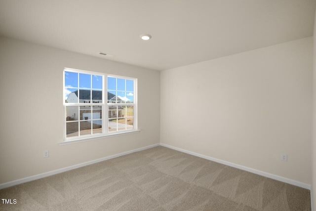 unfurnished room featuring carpet