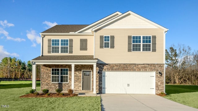 craftsman-style house featuring a front yard and a garage