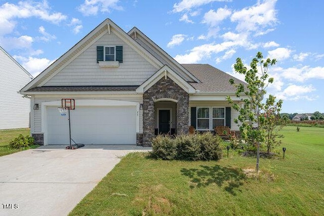 craftsman inspired home featuring driveway, stone siding, a garage, and a front yard