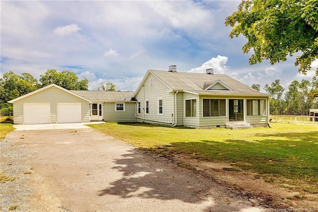 ranch-style house with driveway, an attached garage, fence, and a front lawn