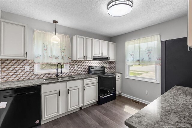 kitchen featuring backsplash, black appliances, sink, dark wood-type flooring, and white cabinets