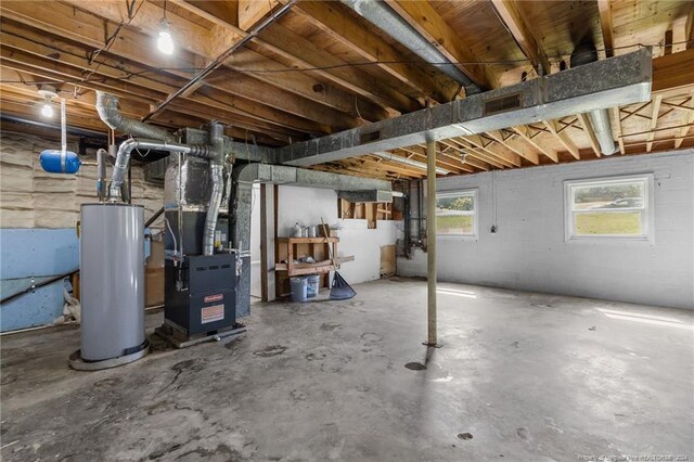 basement featuring heating unit and water heater