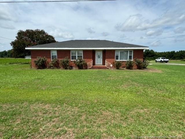 ranch-style house with a front lawn