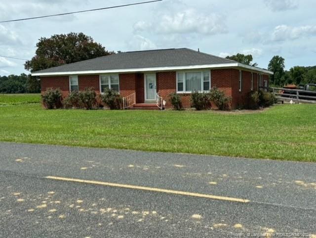 ranch-style house with a front yard