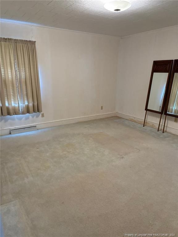 spare room featuring carpet flooring