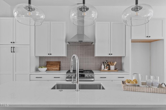 kitchen featuring pendant lighting and white cabinetry