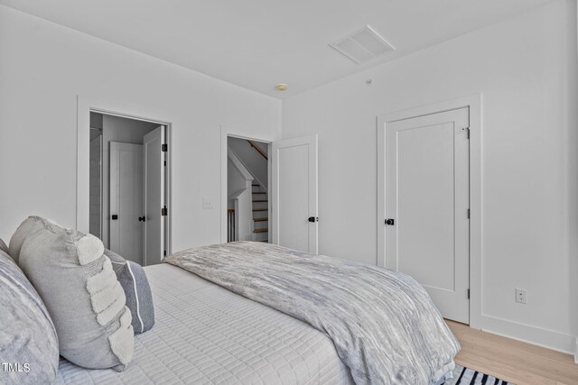 bedroom featuring light hardwood / wood-style flooring