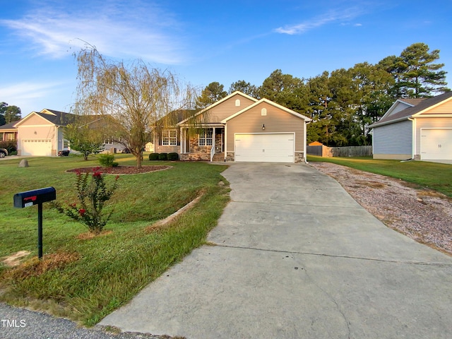 single story home featuring stone siding, a front lawn, concrete driveway, and fence