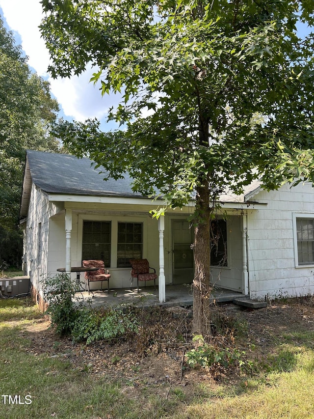 rear view of house with a porch