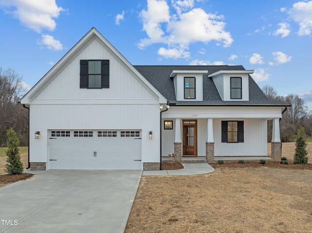 view of front of property with a garage and a porch