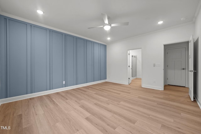 unfurnished bedroom featuring ornamental molding, ceiling fan, and light wood-type flooring