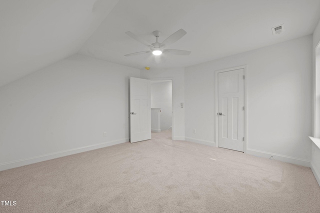 bonus room featuring light colored carpet and ceiling fan