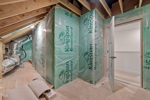 bathroom featuring lofted ceiling