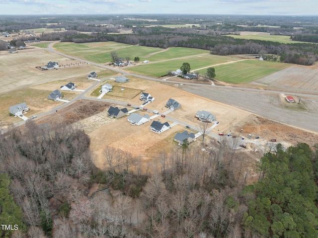 birds eye view of property featuring a rural view