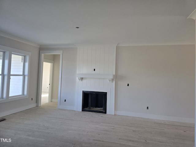 unfurnished living room featuring a large fireplace, light hardwood / wood-style flooring, and crown molding