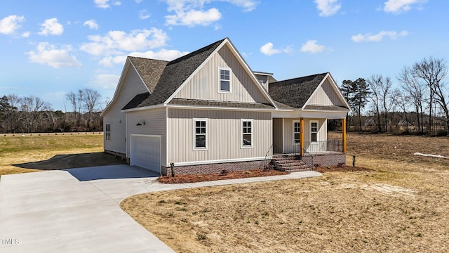 modern farmhouse style home with a shingled roof, covered porch, concrete driveway, board and batten siding, and a garage