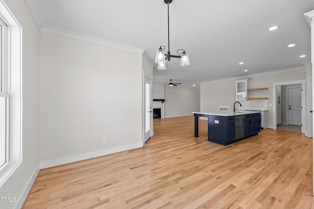 kitchen featuring blue cabinetry, open shelves, light countertops, ornamental molding, and a kitchen breakfast bar